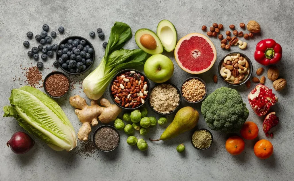 Nutrient-dense whole foods including fruits, vegetables, nuts, seeds, and legumes for a spring cleanse