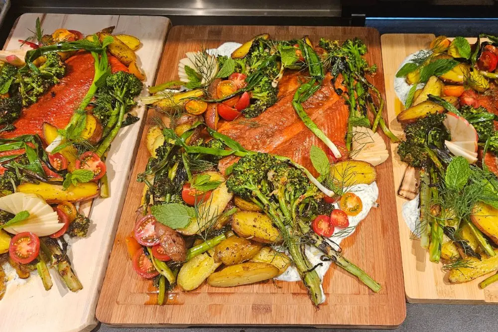 Healthy salmon dinner with seasonal vegetables prepared using whole-food nutrition principles.