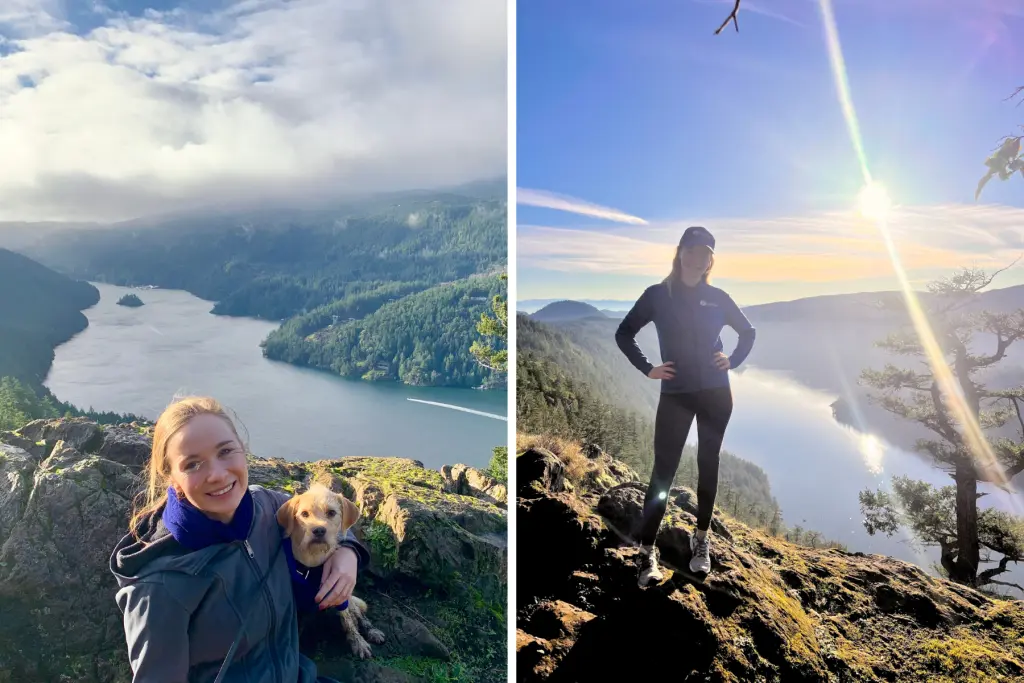 Kathryn McCubbin Sprack hiking with her dog at a scenic mountain viewpoint overlooking a lake surrounded by forest.