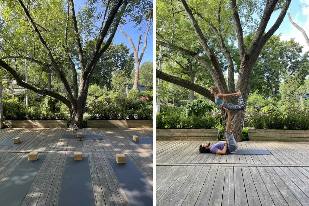 Outdoor yoga space beneath mature trees and Sierra Day practicing acroyoga with a partner.