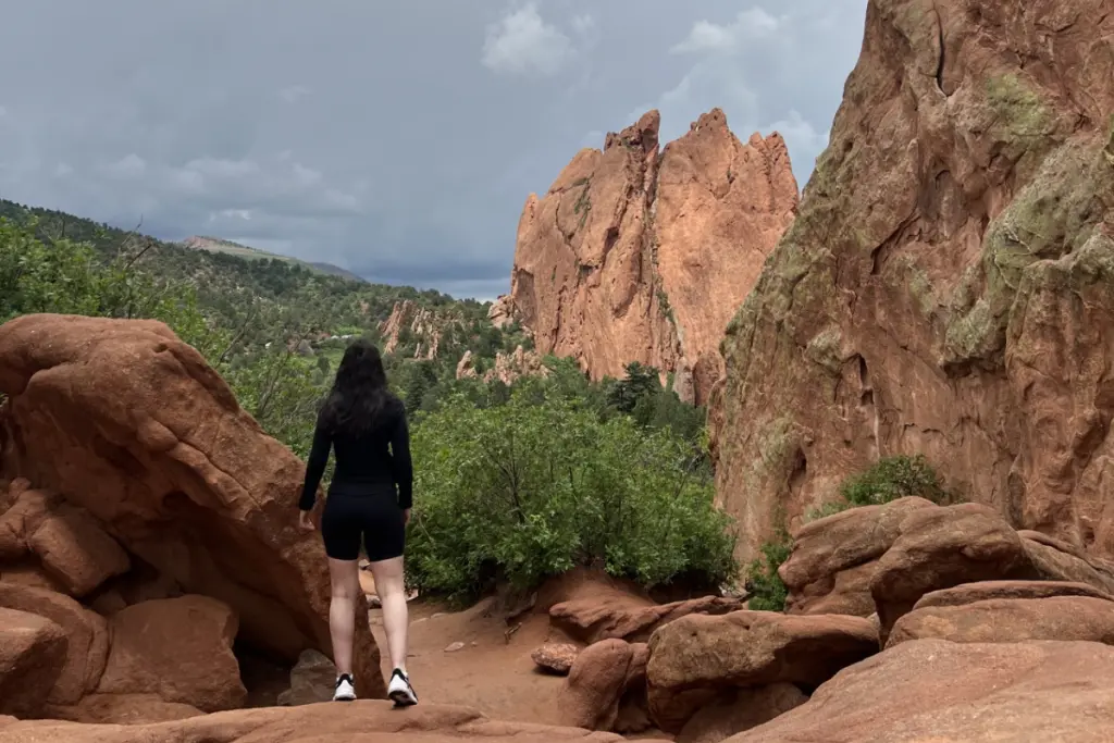 Stephanie Pettinaro exploring a rocky canyon landscape during a hiking adventure.