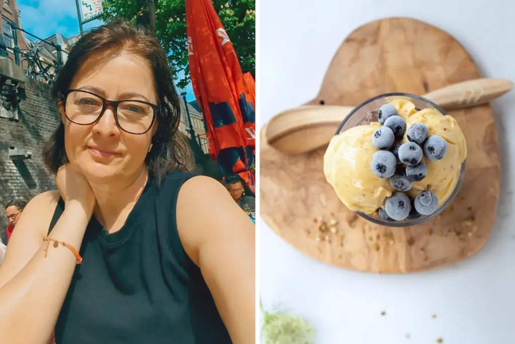 Viosa Koronica Barileva enjoying an outdoor café setting beside a bowl of homemade blueberry frozen dessert.