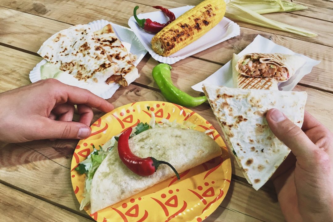 Latine food: corn on the cob, corn tortilla and peppers